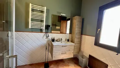 a bathroom with a shower and a sink at Thalea Apartment in Palermo