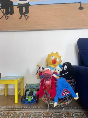 a bunch of stuffed toys in a corner of a room at Corso Tugher in Palermo