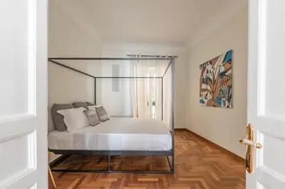 a bedroom with a bed with a glass canopy at Giudici Three Bedrooms Apartment by Wonderful Italy in Palermo