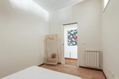 a white room with a bed and a window at Giudici Three Bedrooms Apartment by Wonderful Italy in Palermo
