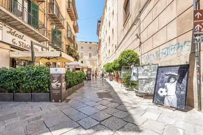 an empty street in a city with buildings at Giudici Three Bedrooms Apartment by Wonderful Italy in Palermo