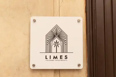 a sign on the side of a building at Limes in Palermo