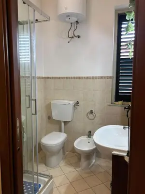 a bathroom with a toilet and a sink and a shower at Alessandra guesting house - Palermo in Palermo