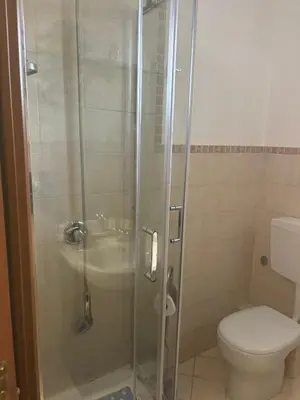a bathroom with a shower with a toilet and a sink at Alessandra guesting house - Palermo in Palermo