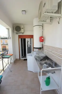 a kitchen with a sink and a counter top at Appartamento La Rosa dei Venti in Porticello