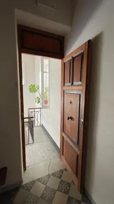 a door in a room with a tile floor at Campofranco Studio in Palermo