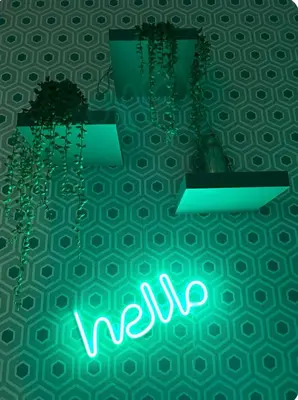 a neon sign that says wii on a wall at Casamori 2- nel cuore di Palermo, mercato Ballarò in Palermo