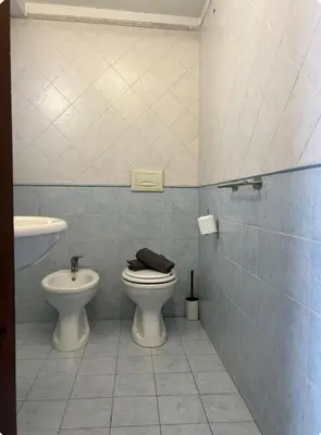 a bathroom with a toilet and a sink at Casamori 2- nel cuore di Palermo, mercato Ballarò in Palermo