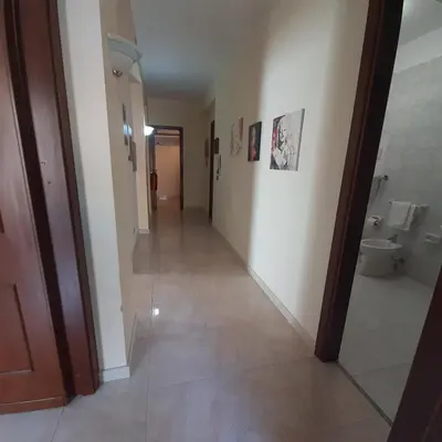 a hallway of a bathroom with a toilet at Maria Isabella appartament in Isola delle Femmine