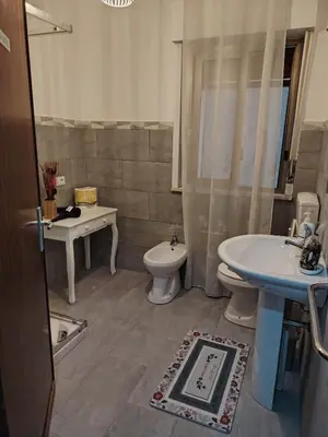 a bathroom with a sink and a toilet and a sink at La casa di Anna e Lillo in Palermo