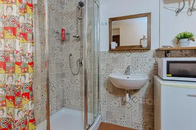 a bathroom with a shower and a sink at La casettina di Dante in Palermo