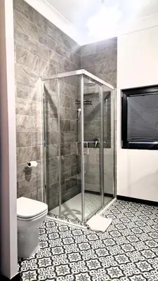 a bathroom with a shower and a toilet at zaraholiday24 in Palermo