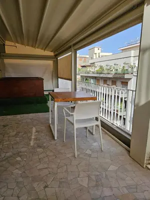 a patio with a table and chairs on a balcony at Bio Hotel Palermo in Palermo