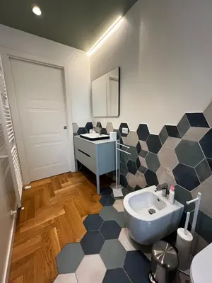 a bathroom with a sink and a counter in it at Guardian Dream Suite House nel cuore di Palermo in Palermo