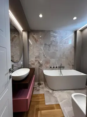 a bathroom with a tub and a sink at Guardian Dream Suite House nel cuore di Palermo in Palermo