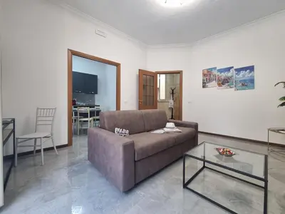 a living room with a couch and a table at Kala Flat by Holiday World in Palermo