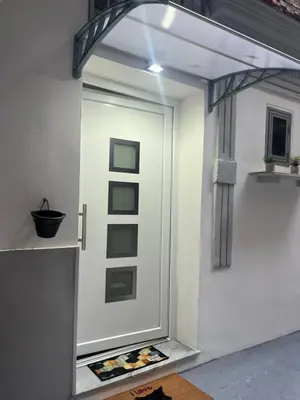 a white door with a picture in front of it at Holiday home tom in Palermo