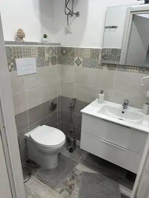 a bathroom with a toilet and a sink at Holiday home tom in Palermo