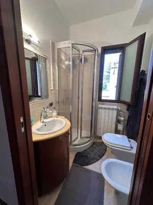 a bathroom with a shower and a sink and a toilet at Villa Oasi Bonita a Mondello in Palermo