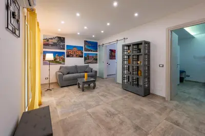 a living room with a couch and a wine cellar at Il Palchetto in Palermo