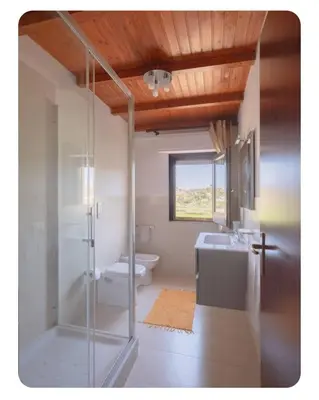 a bathroom with a shower and a toilet and a sink at Cas'aMare Holidays, Home is Love in Castellammare del Golfo
