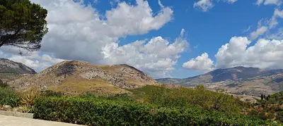 a view of a mountain range with clouds in the sky at Villa Calatafimi Segesta in Calatafimi
