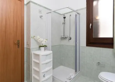 a bathroom with a shower with a toilet and a sink at Indipendente a S vito lo Capo in San Vito lo Capo