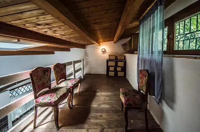a hallway with two chairs and a window at Casa Laghetto in the countryside with a shared pool in Terrasini
