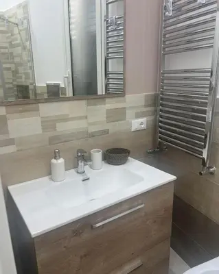 a bathroom with a white sink and a mirror at Palermo Sunhouse in Palermo