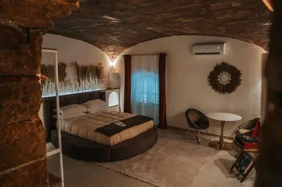 a view of a room with a bed and a window at Zahira suite&spa in Palermo