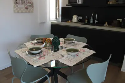 a living room with some plants and a table at La Dimora della Contessa in Palermo