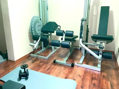 a gym with cardio equipment in a room at Villa in Palermo near the Sea in Altofonte