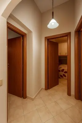 a hallway with two doors and a bedroom at Mongitore 15 in Palermo