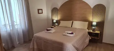 a bedroom with a large bed with two towels on it at Le Gemme di Ballarò in Palermo
