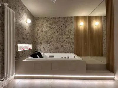 a bathroom with a bath tub in a room at House Spa Palermo in Palermo