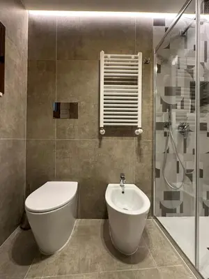 a bathroom with a toilet and a sink at House Spa Palermo in Palermo