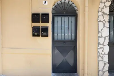 a black door on the side of a building at Anita House in Palermo