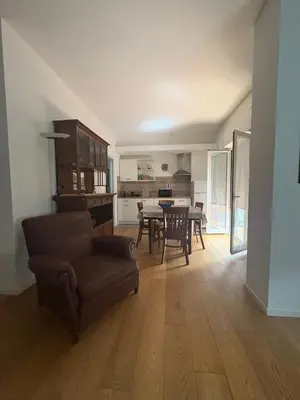 a living room with a couch and a table at una casa tranquilla in Palermo