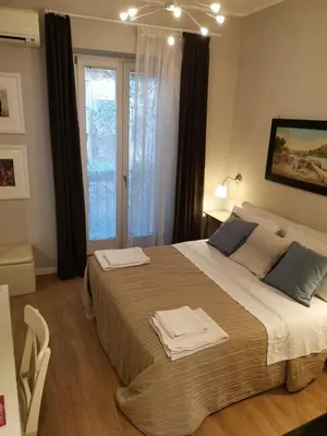 a bedroom with a large bed with towels on it at B&B Museo Salinas in Palermo