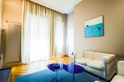 a living room with a couch and a table at Exclusuite Design Apartment in Palermo