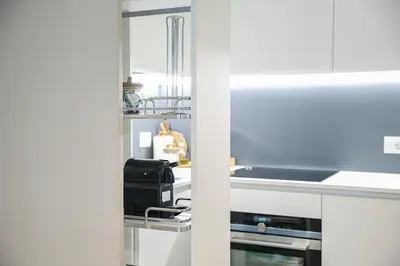 a kitchen with a sink and a counter top at Exclusuite Design Apartment in Palermo