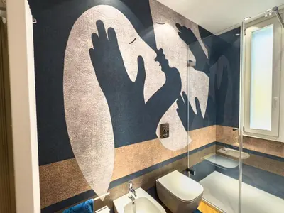 a bathroom with a toilet and a sink at Exclusuite Design Apartment in Palermo