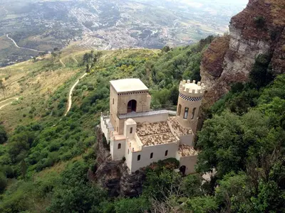 a building on the side of a mountain at Case Della Baia in Castellammare del Golfo