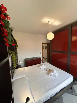 a bedroom with a bed with towels on it at MondHello a 2 passi dal mare in Palermo