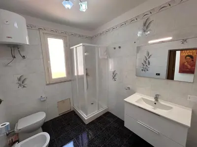 a bathroom with a sink and a shower and a toilet at MondHello a 2 passi dal mare in Palermo