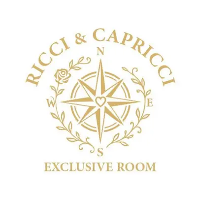 a crest andapa exclusive room logo at Ricci & Capricci Exclusive Room in Aspra