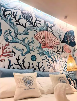 a bedroom with a wall with a mural of seaweeds at Ricci & Capricci Exclusive Room in Aspra