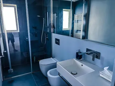 a bathroom with a toilet and a sink and a shower at Palermo sul mare di Isola delle Femmine in Isola delle Femmine