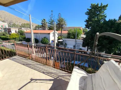 a balcony with a railing with a view of a city at Azzurra Apartment Mondello - Casa Vacanza a due passi dal Mare in Palermo