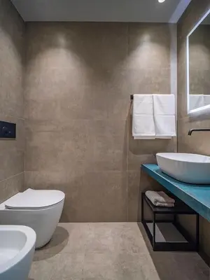a bathroom with two sinks and a toilet at Meschita Sette in Palermo